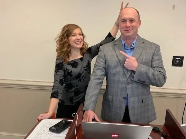 Raxis COO and CTO before a tabletop